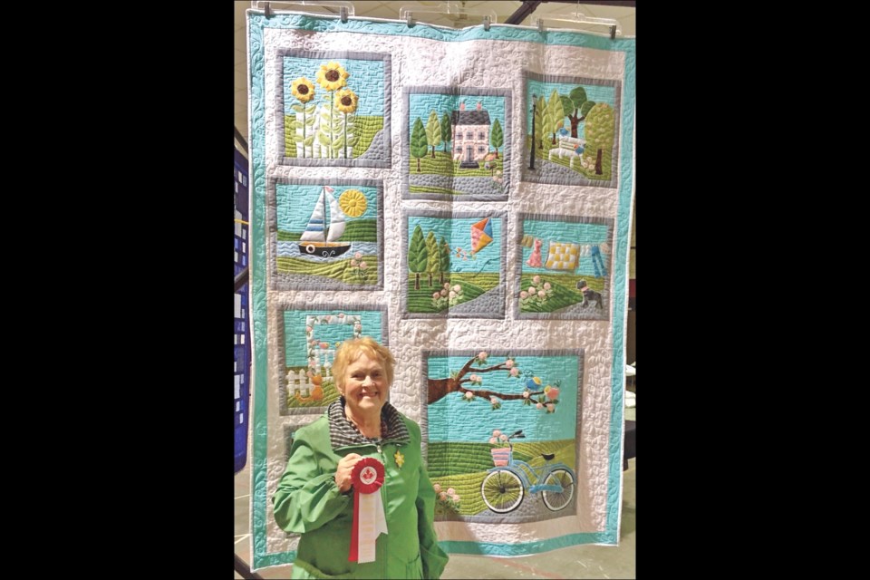 Linda Lautamaus holds the red ribbon she was awarded as the People’s Choice winner at the annual North Star Quilt Guild show, held last weekend at the Flin Flon Community Hall. Lautamaus won the ribbon, awarded by the Canadian Quilters Association, for her quilt “Sunday Ride.”