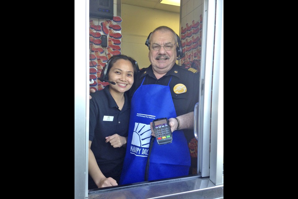 McHappy Day — It was McHappy Day May 4, an annual event when McDonalds restaurants raise money to support local children’s charities and more than 20,000 families across Canada each year who stay at Ronald McDonald House while their kids are being treated. North Battleford Fire Chief Albert Headrick was helping out Wednesday morning. Photo by Jayne Foster