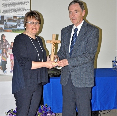 The Lumen Christi Staff Award goes to Eugene Rice of JPII. He was presented the award by board member Stephanie Merkowsky.