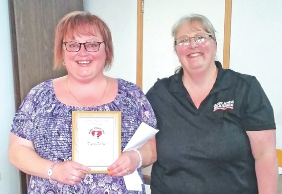 Tijana Clarke (left) accepted the Community Volunteer of the Year Award from SPCA president Erica Husberg.