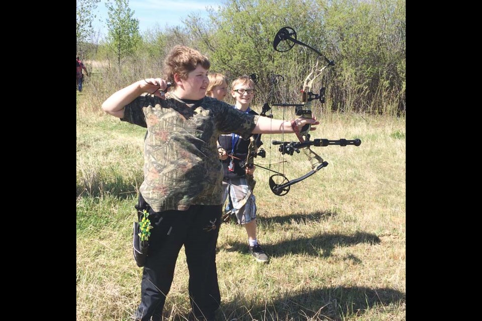 Layne Thompson, take a shot while Zander Hollinger, and Isaac Hollinger await their chance.