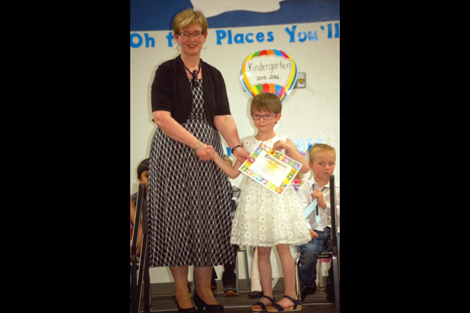 Anebeth Bartel received her Kindergarten certificate from her teacher Bonnie Lisitza.