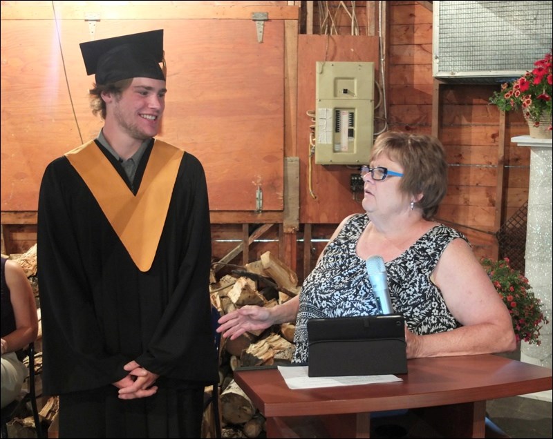 Connor Henderson was all smiles as teacher Maureen Reagan spoke about her time teaching him.