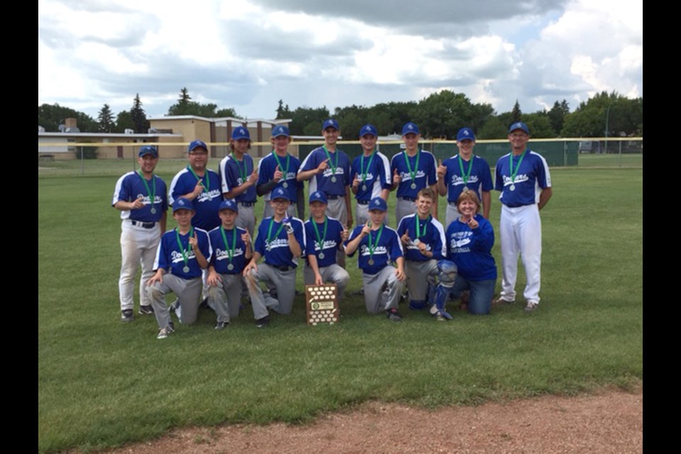 The Humboldt Bantam AA Dodgers captured the Tier 3 Provincial Championship on Jul. 17 in Regina. The Dodgers cruised through the tournament with a perfect 5-0 record capped off with a 6-2 win over the Regina White Sox. Pictured (L to R) Back Row: Coach Curtis Fontaine, Coach Linsey Smith, Carson Horachek, Gabe Zerbin, Braden Fleischhacker, Brandon Hilkewich, Cole Bells, Logan Stumborg, and Head Coach Morris Tarnowski. Front Row: Derek Tarnowski, Aiden Rowe, Kalen Ukrainetz, Dakota Smith, Jay Schick, Carter Tarnowski, and Manager Carrie Fleischhacker. photo courtesy of Morris Tarnowski