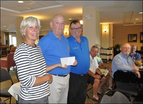 Shannon Langley, general manager of Caleb Manor, accepts a cheque for the purchase of an automated external defibrillator from Brodie Partington, long time Rotarian and resident of Caleb Manor, and Rotary club president Warren Williams. Photos by Jayne Foster