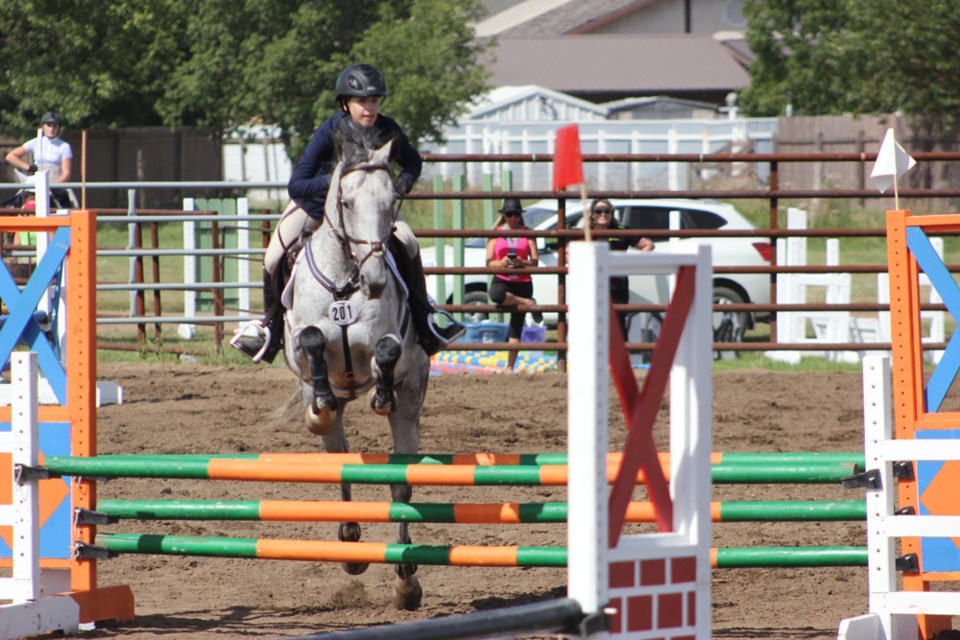 Rebecca Robison of Regina rode her horse to an eighth place finish in equestrian jumping.