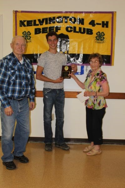 John Ake received an award for grand champion fed calf from Mike Babecy and Muriel Geck. Akle also received prizes and awards for home-grown fed calf, best Simmental,  senior grooming, senior fed calf and overall grooming.