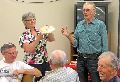 Doug Haryung auctions the pies and the museum gets a good sum!