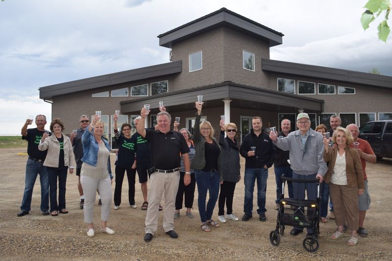 Last week members of the Assiniboine Valley Health and Wellness Foundation, its health centre fundraising committee, major sponsors and active supporters of the project assembled in front of the centre and toasted the fact that for all but about $20,000 the facility has been fully paid.