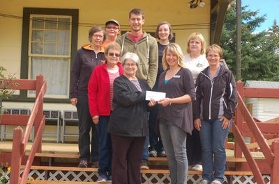 The Sturgis Station House Museum accepted a donation from the Crossroads Credit Union on August 19. From left, were: (back row) Barb Wagar, Zanthany Olson, Adam Wyonzek, Sarah Brown and Karen Rose and (front) Verna Karpyk, Myrtle Boychuk, Leanne Christianson and Doreen Bochnuik.