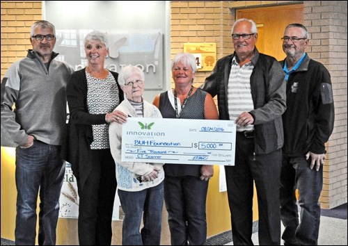 Boost for BUHF — Rosalie Payne (second from left) of Innovation Credit Union presented a cheque for $5,000 to Battlefords Union Hospital Foundation board members Wednesday. Cheryl Mitchell (third from right), director of Medical Imaging at BUH, says the money will go towards a new CT scanner.