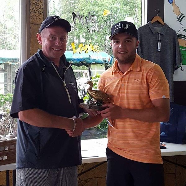 For the second consecutive year, Matt Procyshen, right, of Saskatoon topped the Golden Duck golf championship at Madge Lake. Presenting the winner with the trophy was Rich Patterson, owner of the Madge Lake Golf Resort.