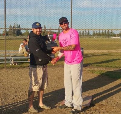 Kerry Fullawka, right, accepted the trophy for the Canora Slo-pitch League playoffs from Devon Sawka, vice-president.