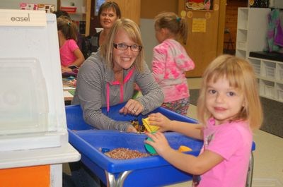 Lori Newton interacted with Blakely Firman during the Preeceville Nursery School registration evening and met the teacher.