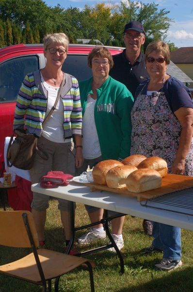 Special visitors from Denmark were treated to freshly baked bread from the Preeceville and District Heritage Museum. From left, were: Tove Petersen, Agnes Murrin, Finn Petersen and Darlene Medlang.