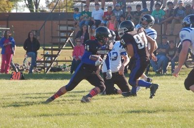 Bo Babiuk was helped by Connor Novak as he made his way down the football field.