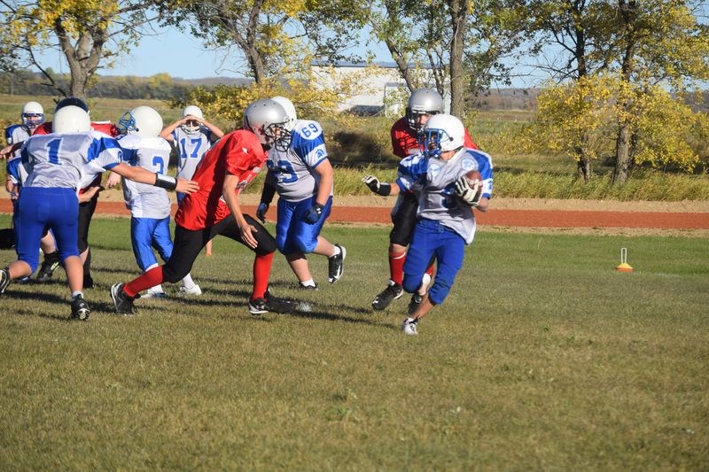 AIDEN BRODA RUNNING WITH THE BALL