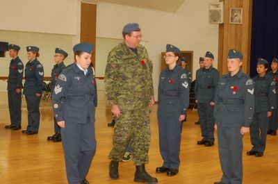 F/Sgt. Roberta Kaytor led Capt. Ian Coupland as he inspected the Preeceville Harvard Air Cadet squadron.