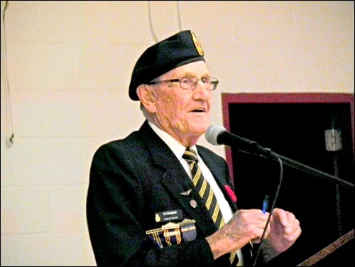 Unity’s only remaining Second World War veteran, 93-year-old Si Campbell, speaks to UCHS students about their video, Highway of Heros, voicing his appreciation for the song and that designation for that Canadian roadway. He also was on hand at all area schools for their annual Remembrance Day services. He beamed at students exiting the UCHS gym in appreciation for their efforts in their service, while not noticing the poignancy of him standing beneath the Wall of Fame title, which most definitely would pertain to his service as a rear gunner in numerous flights over enemy territory in wartime. Photos by Sherri Solomko