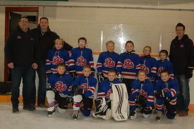 Members of the Preeceville novice hockey team from left, are: (back row) Conrad Peterson and Dean Serdachny (coaches), Alex Niellson, Carsyn Galiz, Luke Sandager, Trae Peterson, Darian Serdachny, Erron Bochnuik, and Kent Seerey (coach) and (front) Connor Burym, Bracyn Konkel, Parker Ryczak, Hudsyn Maier and Avyn Seerey.