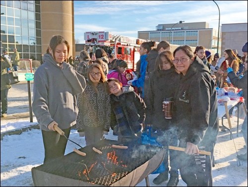 Winter Festival
Just because the temperature has cooled down doesn't mean Downtown NB has. The North Battleford Business Improvement District held its Winter Festival and parade Saturday afternoon. The road in front of Innovation Credit Union was blocked for a game of shinny, sleigh rides and a wiener roast. A good-sized crowd came out to take in the sunshine (despite the biting wind) to take in the winter festivities. The festival was followed by the Santa Parade. Photos by Shannon Kovalsky