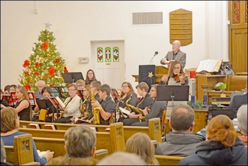 Do You Hear What I Hear?
Third Avenue United Church had anything but a silent night Tuesday, Dec. 13 as host of the Carol Festival. The public was invited to enjoy, and join in singing, a program of Christmas carols. On the program was the City Kinsman Band, North Battleford Comprehensive High School Choir, Piper Mutch and Kathleen Abrahamson accompanied by Lisa Hornung, the Meota Beach Boys accompanied by Jo Carter, Battlefords Blend, Saxophone Quartet, Jubilation Handbell Choir, Dave Tupling accompanied by Gary Gansuage and the Third Avenue United Church Senior Choir. Photo by Shannon Kovalsky