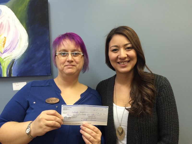 Carleigh Sugawara, right, of Kamsack was the winner of the Kamsack Library’s 50/50 fundraiser of $325. The draw was made during the Moonlight Madness event in Kamsack on November 25. With Sugawara is Nicole Larson, librarian.