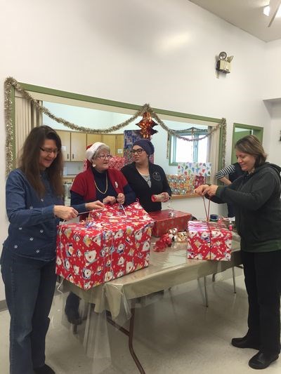 Individuals who participated in wrapping Christmas gifts for the Filling the Gap Christmas program at the Grace United Church, from left, were: Barb Biccum, Leanne McDonald, Brittany Corbett and Arlene Lingl.