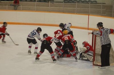 A scramble was held in the front of the net with Isaiah Maier and Seth Hort coming out with the puck during a Preeceville peewees' home game against Langenburg on January 15.