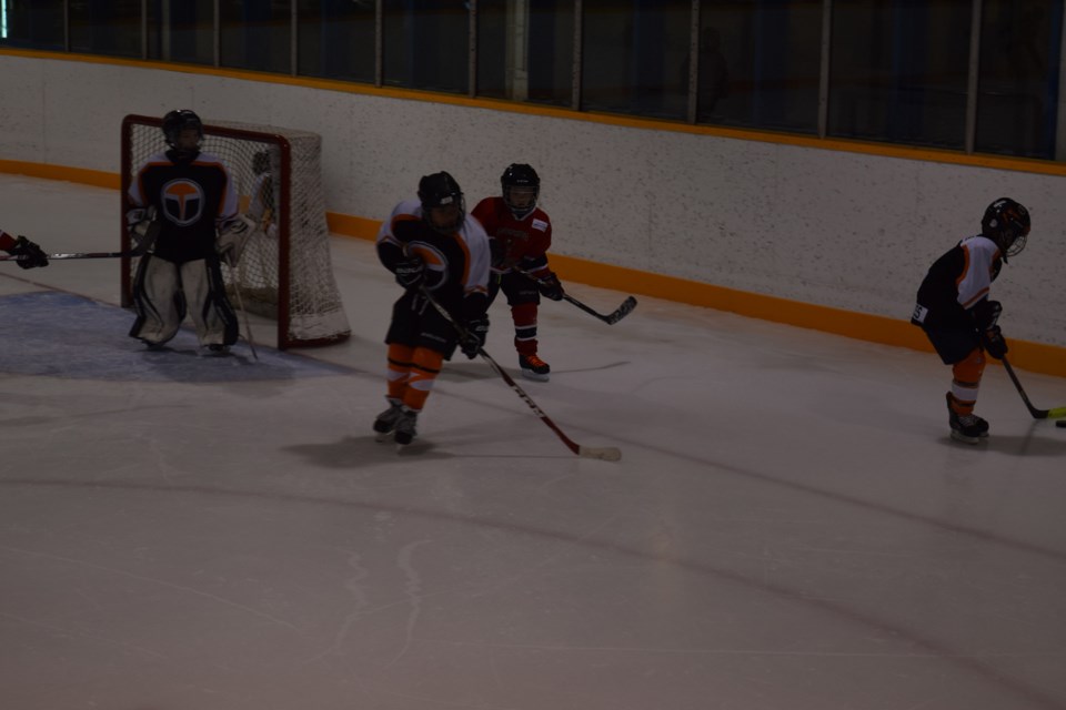 Jhett Kelly came around the net to get the puck back from a player with the Yorkton Thorsness Terriers.