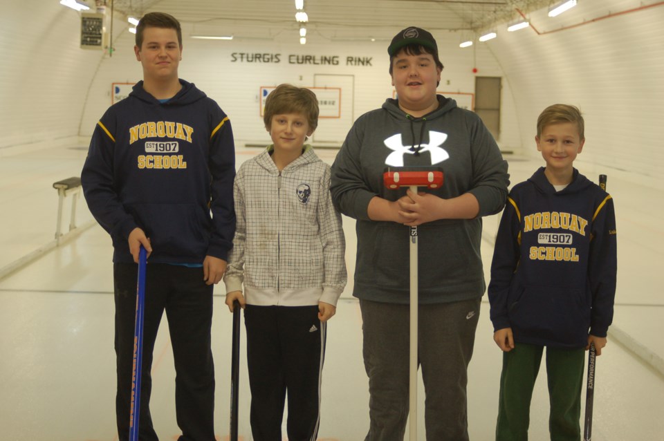 Members of the Norquay junior boys curing team