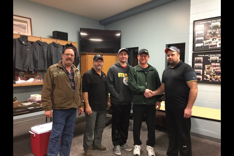 The Bob Kolodziejski rink of Canora topped the A event of the Canora Town and Country bonspiel held January 25 to 29. Members of the team, from left, were: Corey Tibbett (lead), Robin Ludba (second), Bryan Kolodziejski (third), and Bob Kolodziejski (skip). They were congratulated by John Zbitniff, vice-president of the Canora Curling Club.