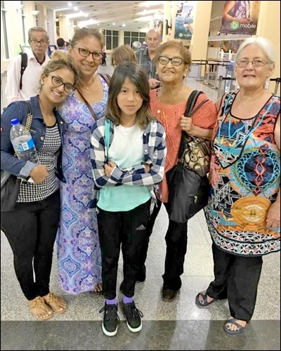 Valerie (far right) and Kakike (center) with family in Trinidad.