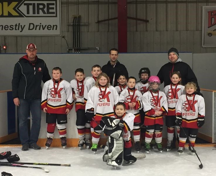 The Kamsack Novice Flyers team at the Broda Sportsplex on February 12, from left, were: (back row) Derek Shankowsky (assistant coach), Ryan Gareau (assistant coach), Jeremy Allard (coach), (third), Slade Shankowsky , Kealand Thomas, Cameron Allard, Joshua Vidomski, Brady Rezansoff, (second), Shilo Blackwood-Eliuk, Parker Lorenzo, Rosalyn Airriess, Shayla Allard, Rhys Lawless, and (front), Jackson Gareau (goalie).