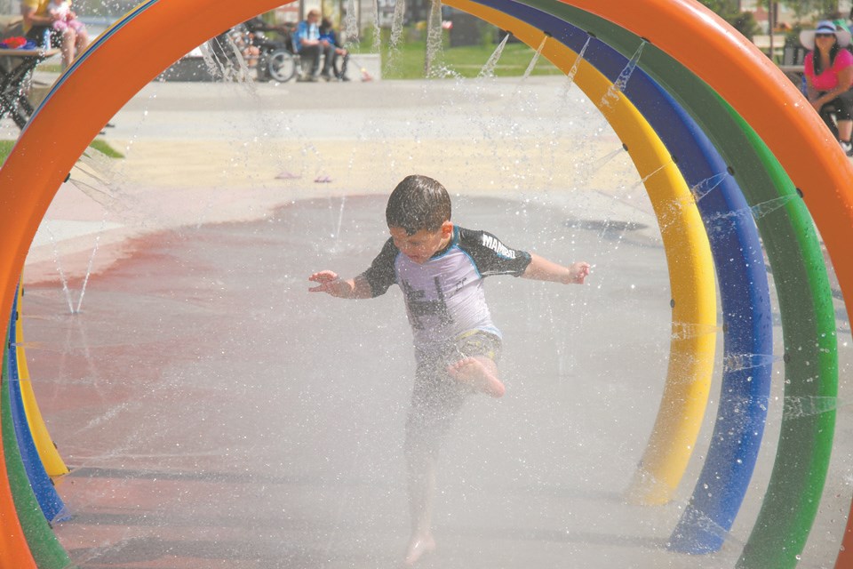 Wonderful water
Brody Beaudry, 4, really gets into the fun as he hops and kicks his way through a water tunnel at the  Mattamy Homes Spray Park in Chinook Winds on June 23. As the days get warmer, expect the spray park to get busier as Airdronians seek to beat the heat.
Allison Chorney / Rocky View Publishing