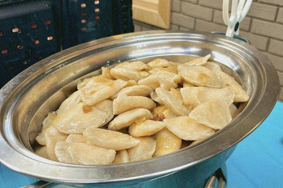 A large serving dish filled with fresh perogies made by Saskitoba in Nisku, Alberta / Saskitoba, Facebook