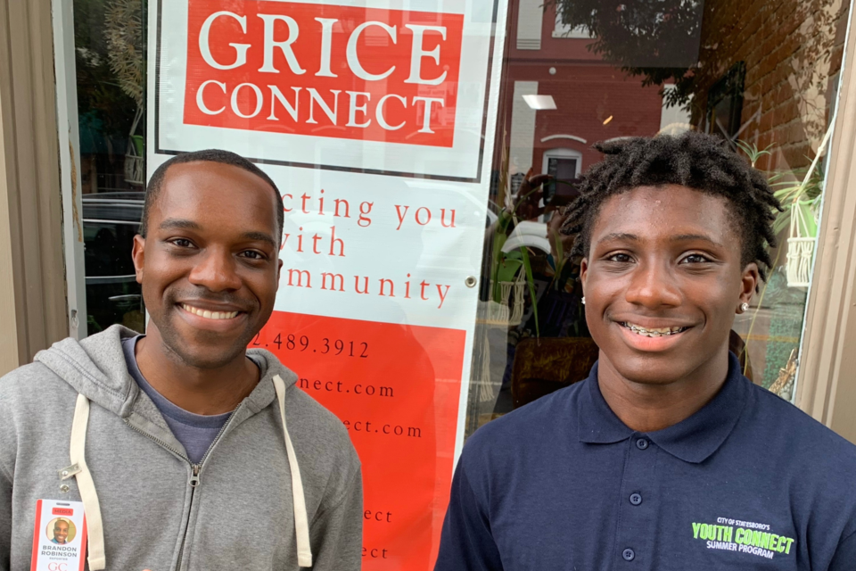 Ja'Kori Cope (right) shadows Grice Connect's Brandon Robinson (left) on a day full of local interviews.