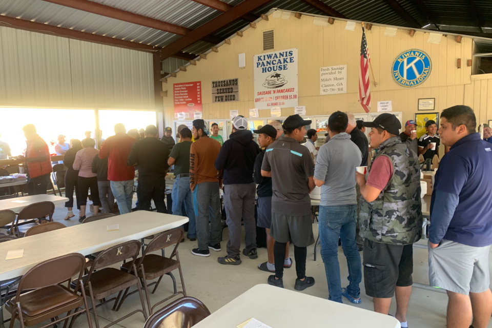 Kiwanis Fair Workers in line to eat a lunch prepared by First Baptist Church.