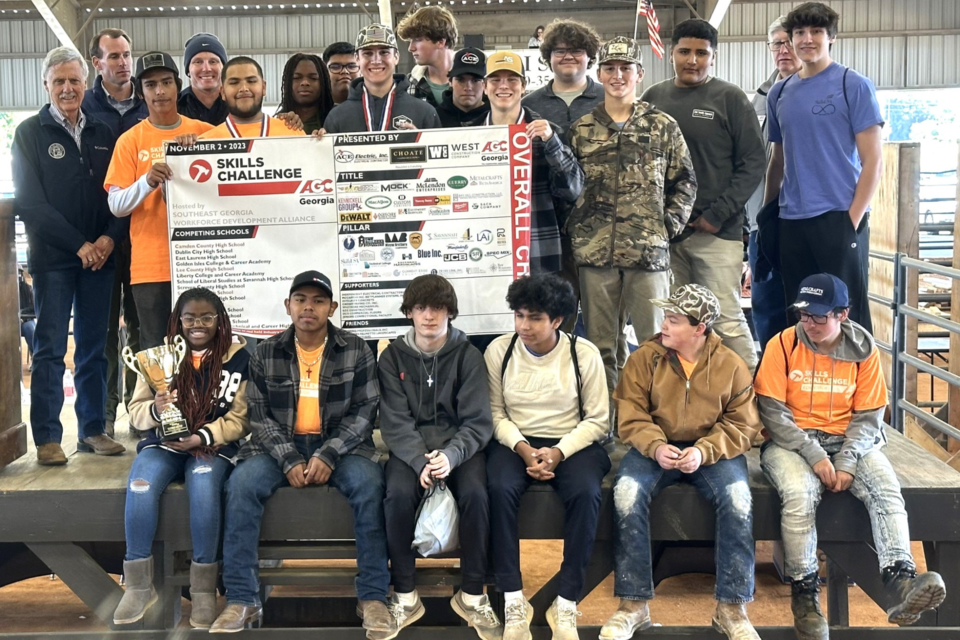 Senator Billy Hickman (R – Statesboro; front row standing, far left) congratulates Statesboro High School Architecture & Construction students and SkillsUSA members and SHS Construction Teacher Josh Hall (back row, third from left) after their first place overall win in the Southeast Georgia Skills Challenge on Nov. 2, at the Bulloch County Ag Center in Statesboro. Photo and caption courtesy of the Bulloch County School Facebook Page. 