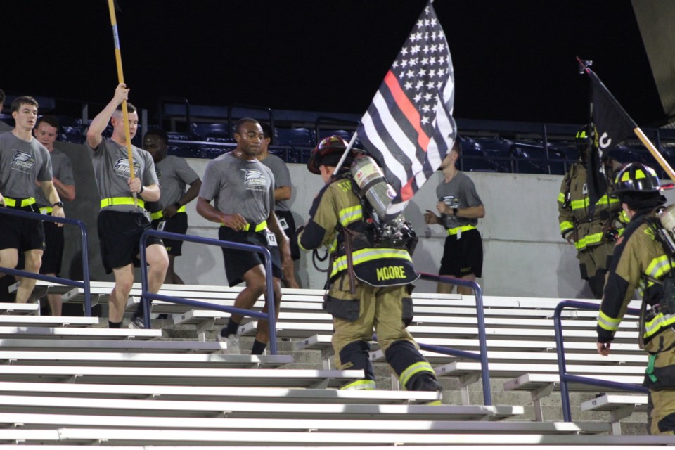 Statesboro Firefighters and Eagle Battalion Cadets march the steps of Paulson Stadium to remember the lives lost on 9/11/2001.
Photo by Ashley Austin