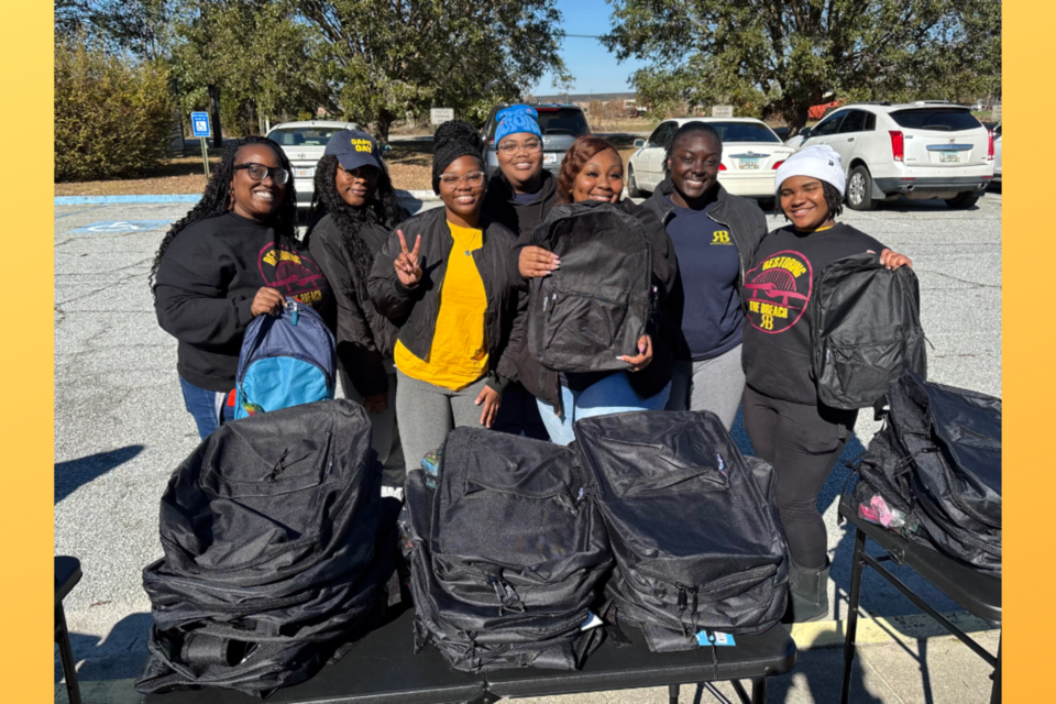 Restoring the Breach's LaShai Campbell, far left, with volunteers at the event on Monday, January 20, 2025