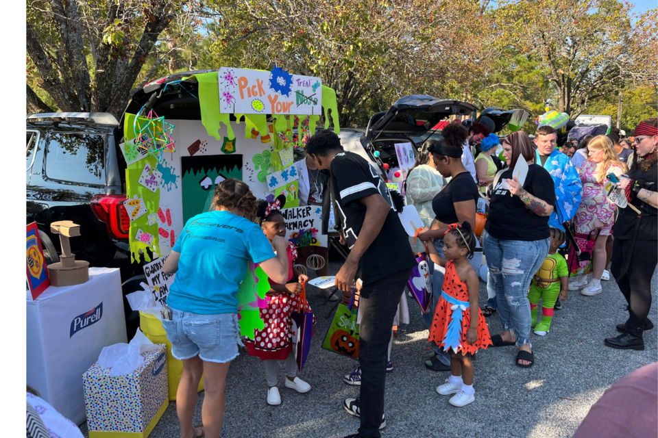 Minnie Mouse and Pebbles visit Walker Pharmacy's germ-themed trunk