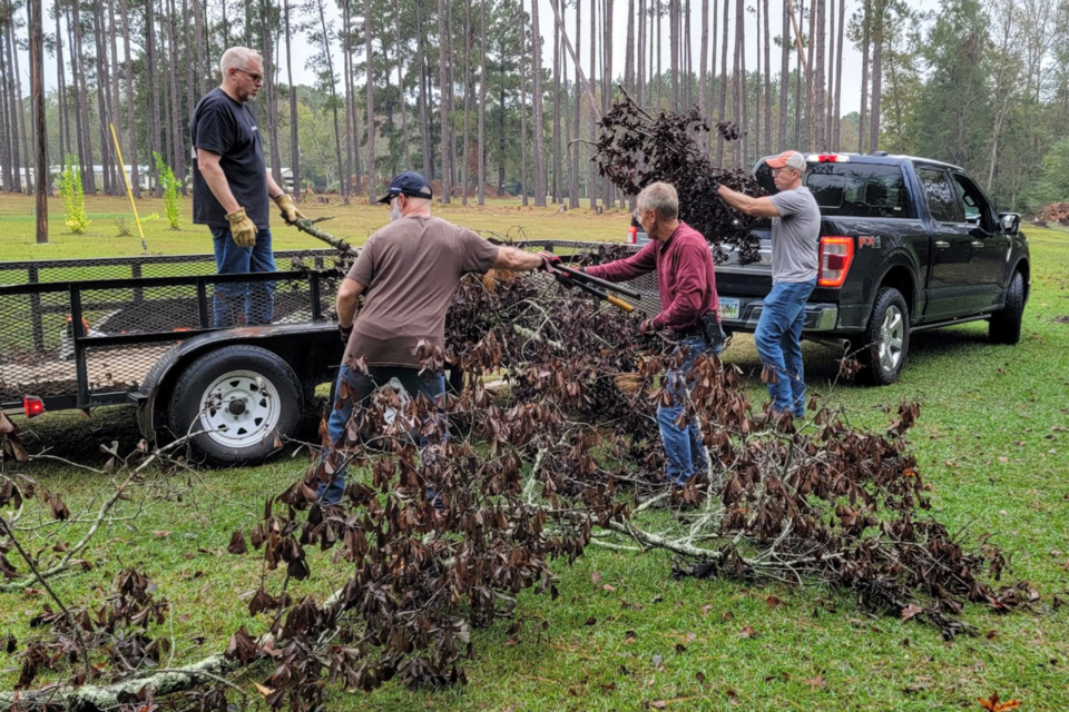 Bulloch VOAD member Dr. Frank Davis and Georgia Baptist volunteers clear debris