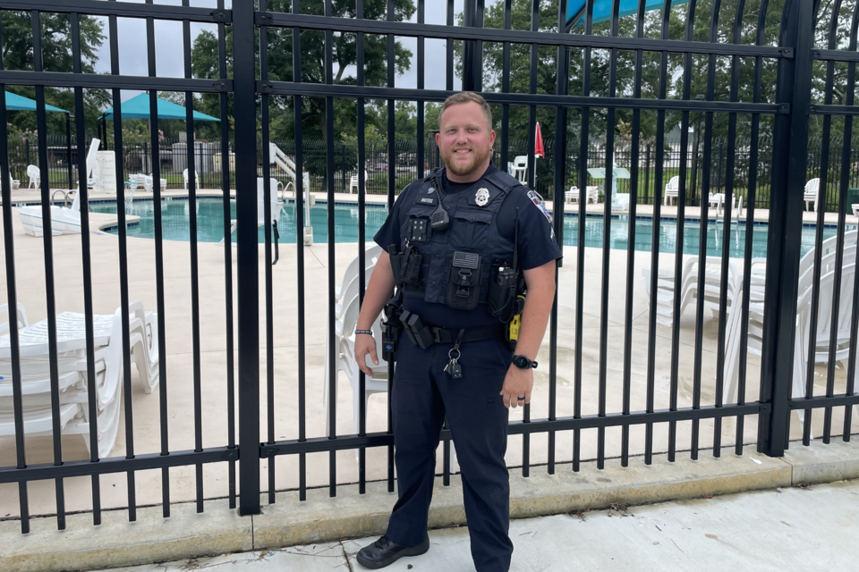 Officer Waters, one of the first responders on scene, in front of the Luetta Moore Pool