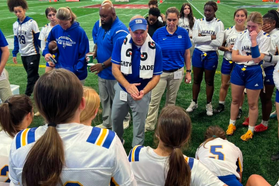 seb-flag-fb-coach-nick-cochran-talks-to-team-during-halftime