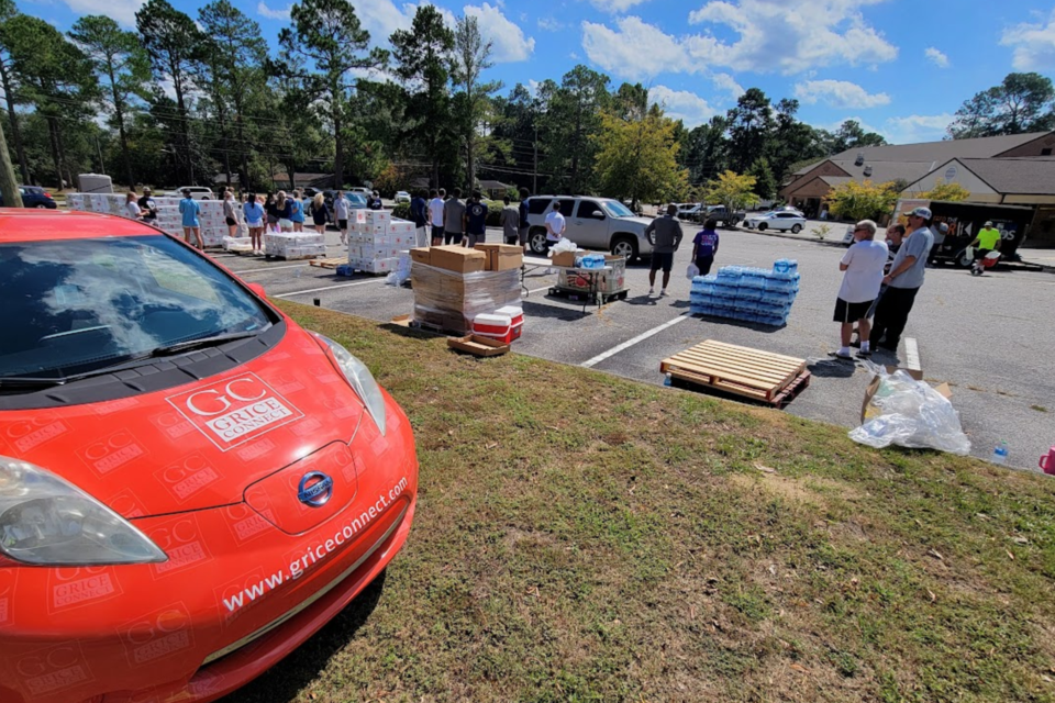 GS Athletes assisting with VOAD emergency food and water drop at Pittman Park UMC