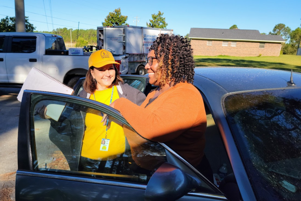 Georgia Baptist Disaster Relief Chaplin Gloria Harper Anderson (L) reassures homeowner Sandra Wooten (R)