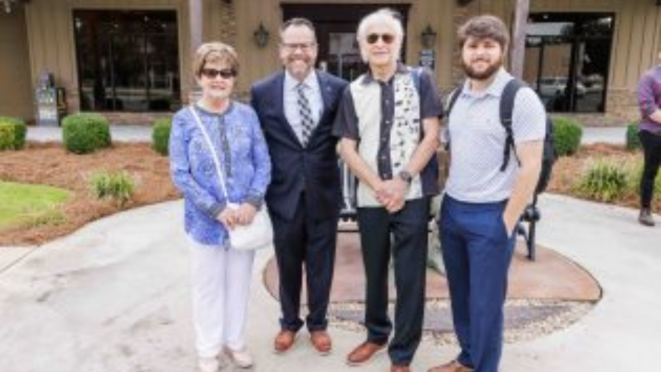 Dinah Gretsch, Georgia Southern President Kyle Marrero, Fred Gretsch and Logan Thomas