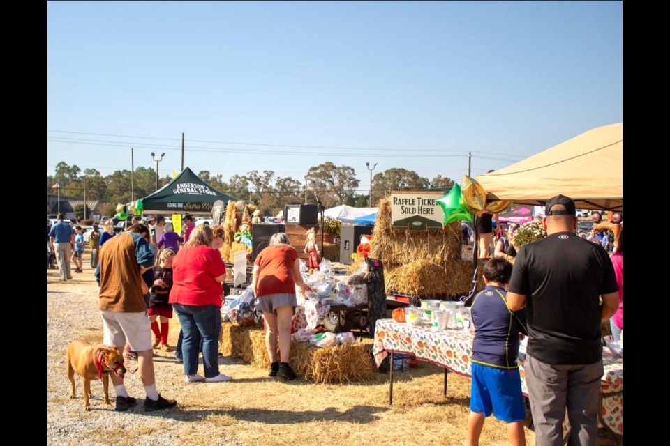 People crowd outside of different tents and vendors at Old Farm Day 2024 hosted by Anderson's General Store. Photo credit: Capture Grace Photography