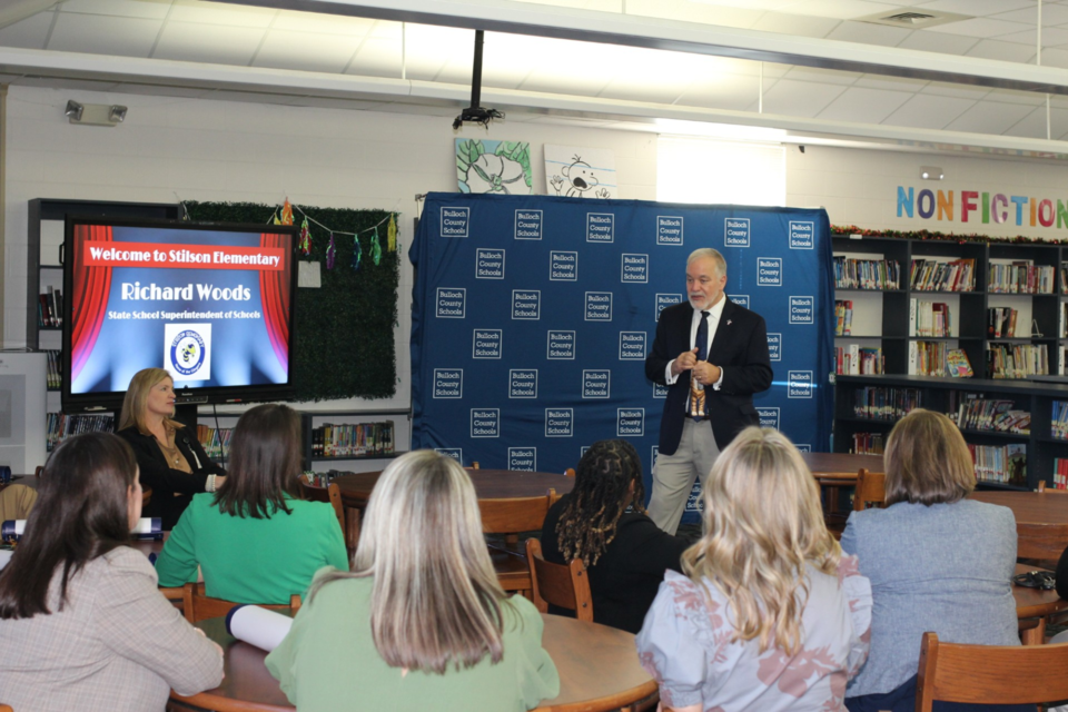 State Superintendent Richard Woods speaks to the principals. 